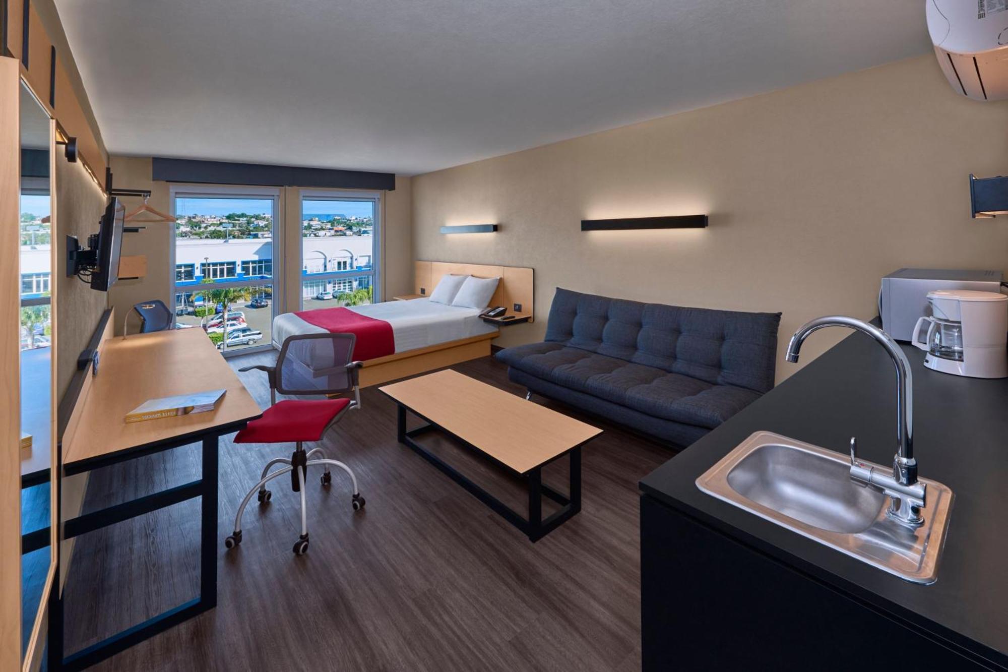 Habitación Doble Superior con sofá cama